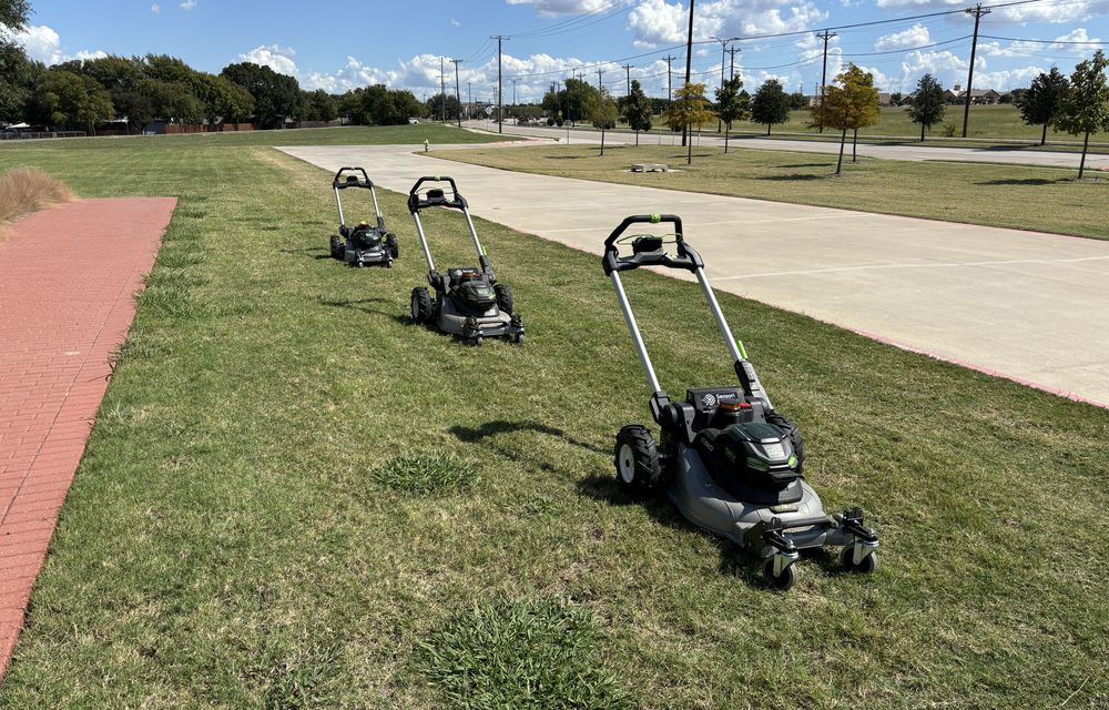 Three Sensori autonomous mowers working in coordinated formation on a Texas roadside